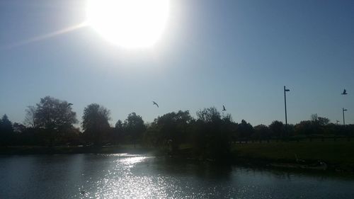 Scenic view of calm lake against clear sky