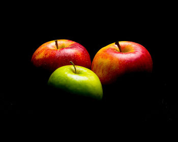 Close-up of apples on black background