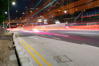 Light trails on city street at night