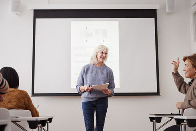 Woman giving presentation at seminar