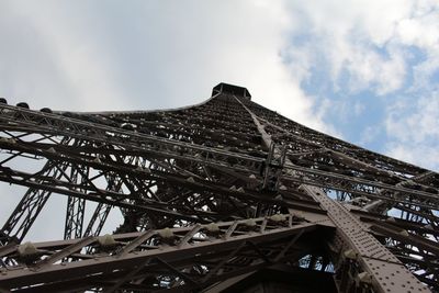 Low angle view of bridge against cloudy sky