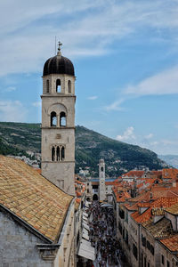 Stradun street and franciscan church and monastery in dubrovnik - old town in summer, light blue sky