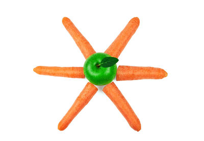Close-up of orange over white background