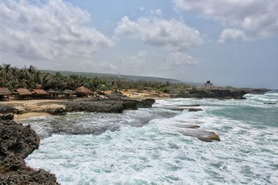 Scenic view of sea against cloudy sky