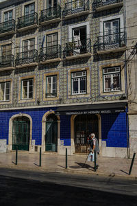 Man standing in front of building