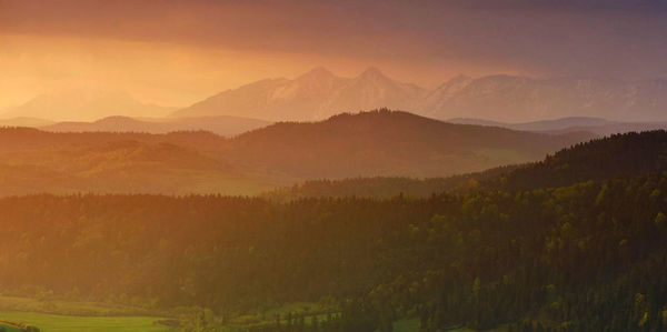 Scenic view of mountains against sky during sunset