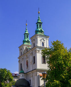 Low angle view of church against clear blue sky