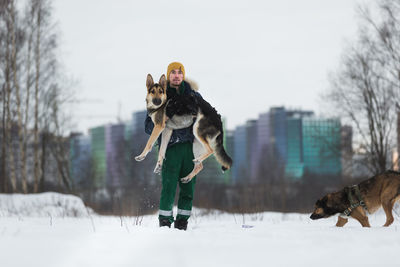 Dog on snow covered field