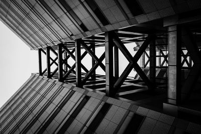 Low angle view of bridge in building against sky