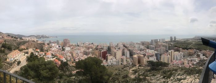 High angle view of buildings in city against sky