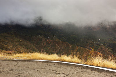 Empty road in foggy weather