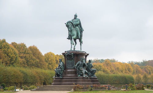 Low angle view of statue against sky