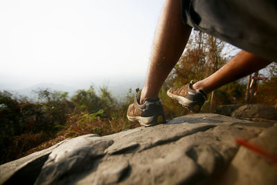 Low section of woman on rock