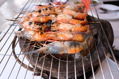 High angle view of meat on barbecue