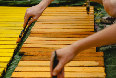 Close-up of man working on wood