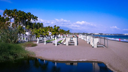 Scenic view of swimming pool by sea against sky