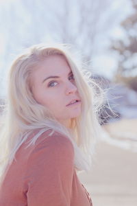 Portrait of young woman with blond hair