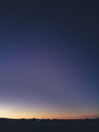 Scenic view of silhouette landscape against clear sky at night