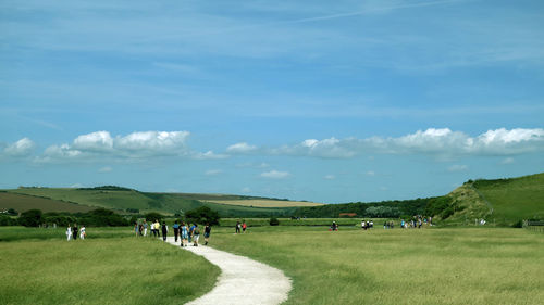 People on field against sky