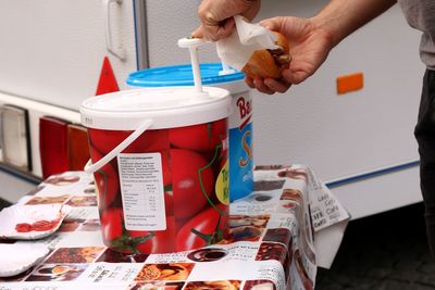 Midsection of person holding food