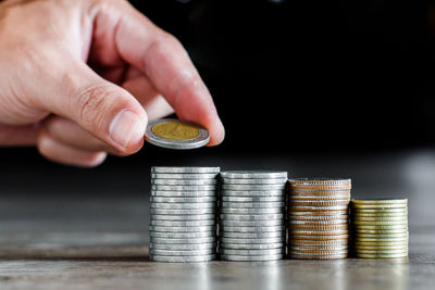 Close-up of hand holding coins