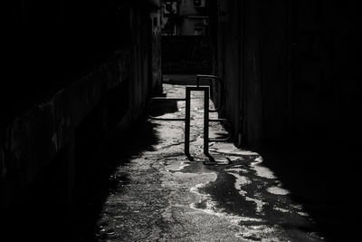 Empty alley amidst buildings in city