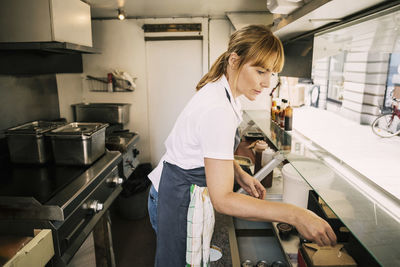 Woman working in food truck