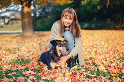 Portrait of a dog standing on landscape during autumn