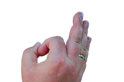 Close-up of hand against white background