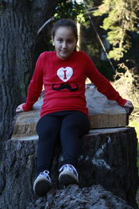 Portrait of boy sitting outdoors