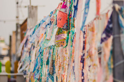 Close-up of clothes hanging in store for sale