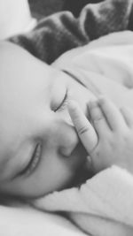 Close-up of woman hand on bed