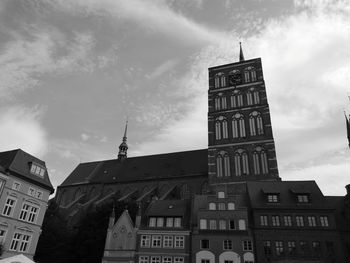 Low angle view of building against cloudy sky