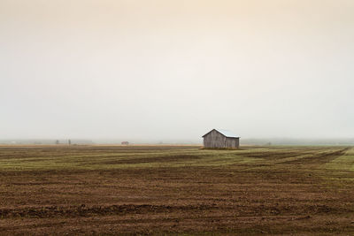 House on field against sky