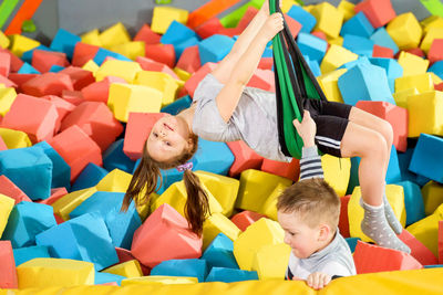 High angle view of people in multi colored toys