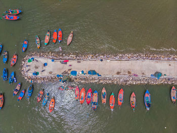 High angle view of boats moored at harbor