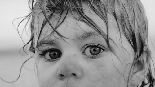 Close-up portrait of girl with wet hair