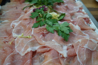 Thin slices of prosciutto, raw ham