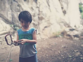 Portrait of girl holding mobile phone