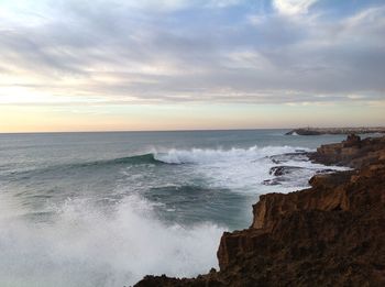 Scenic view of sea against dramatic sky