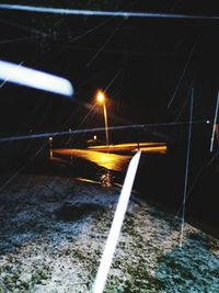 Close-up of illuminated boat in winter at night