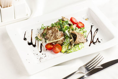 Close-up of meal served in plate on table