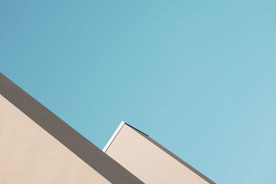 Low angle view of building against clear blue sky