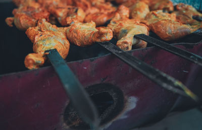 High angle view of meat on barbecue grill