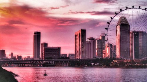 City at waterfront during sunset