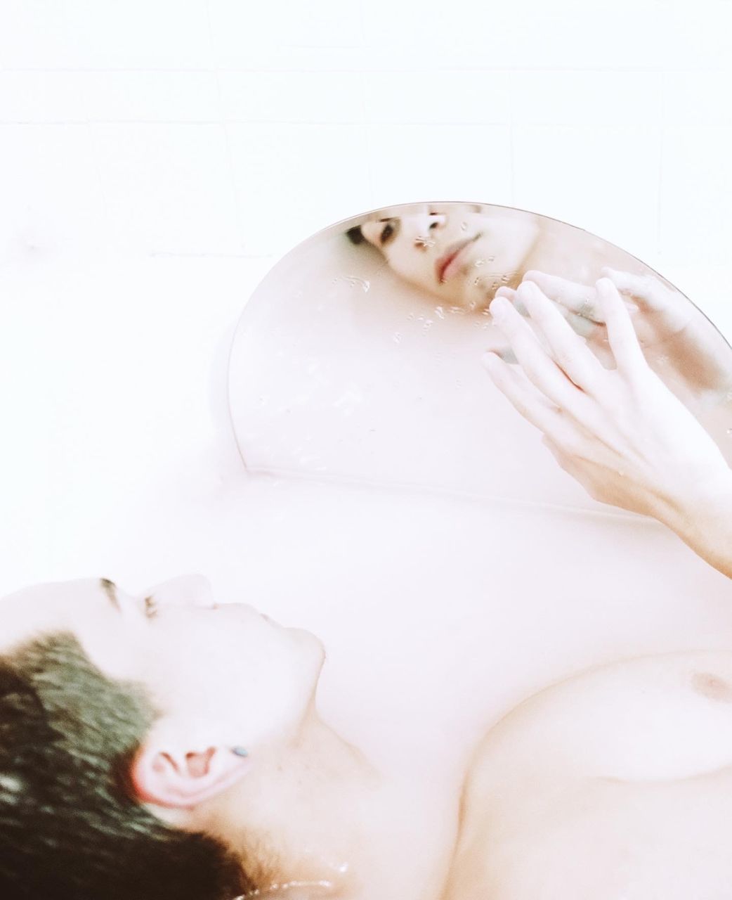Bathtub Indoors  One Person Taking A Bath Adult Domestic Bathroom Bathroom Water Women Human Face Soap Sud Hygiene Eyes Closed  Relaxation Young Adult Domestic Room Hand Body Care Portrait Nature