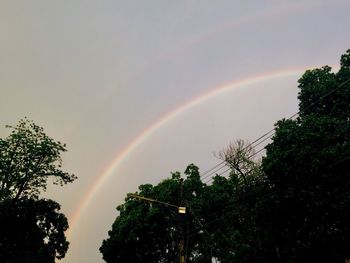 Low angle view of rainbow against sky