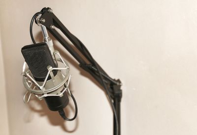 Close-up of microphone against wall