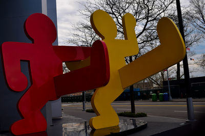 Low angle view of yellow sculpture on playground