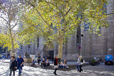 People walking on street in city